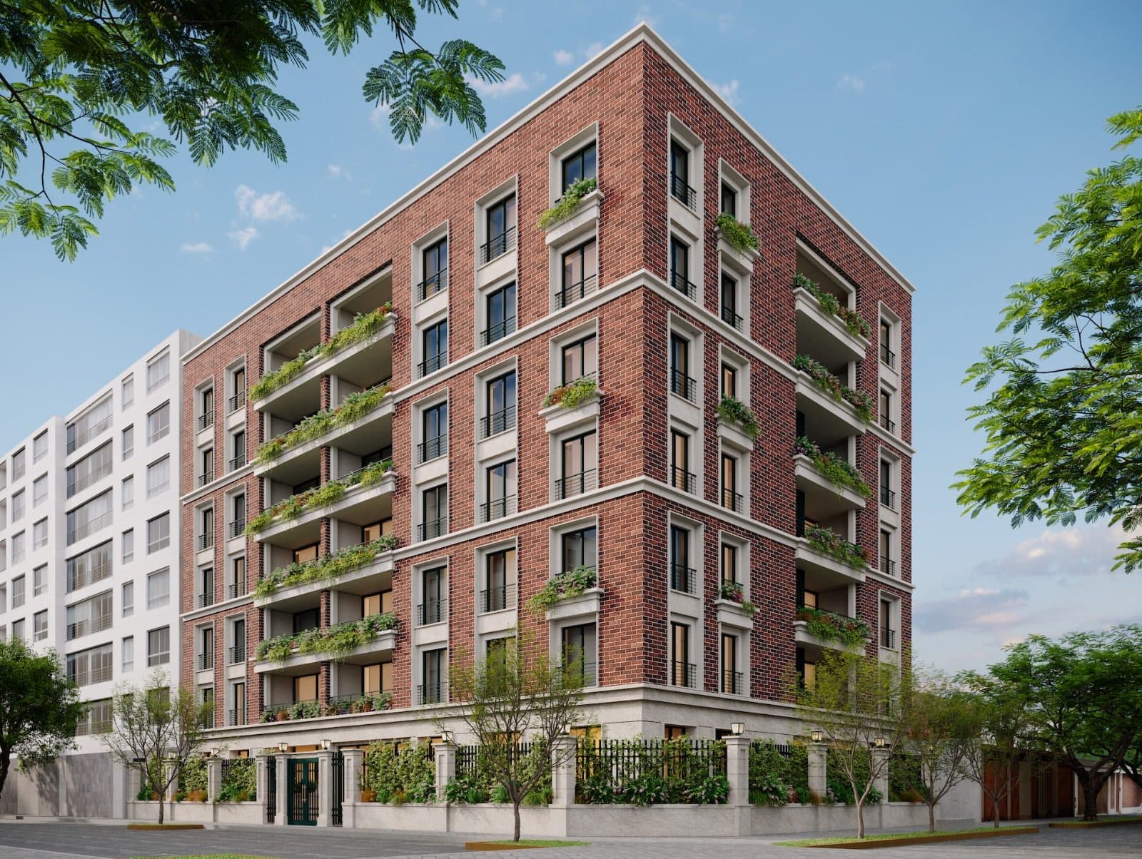 Los Libertadores 390 seen from the corner: an exposed brick façade with planted terraces on every floor, framed by trees